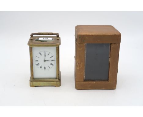 A French brass and glass carriage clock with travel case Condition Report:Available upon request