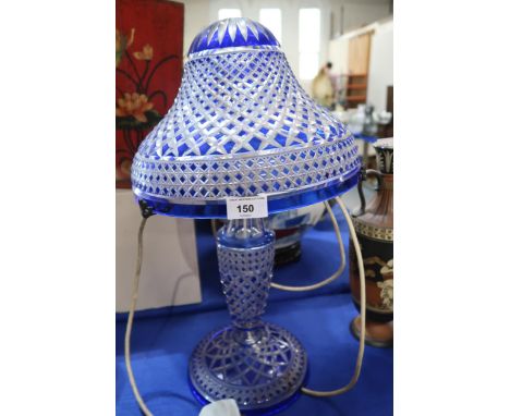 A blue flashed and cut glass table lamp and shade Condition Report:Available upon request