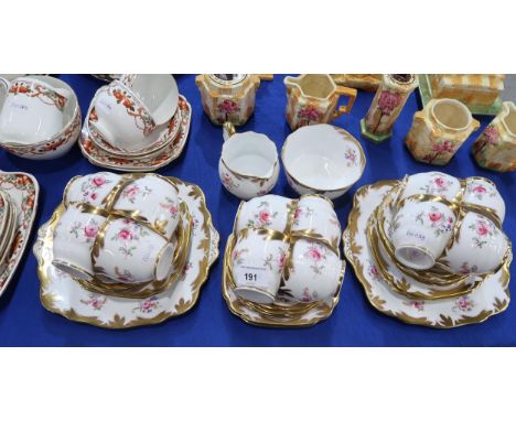 A Royal Albert teaset transfer printed and overpainted with roses, together with Duchess, Gainsborough, Melba and Heathcote t