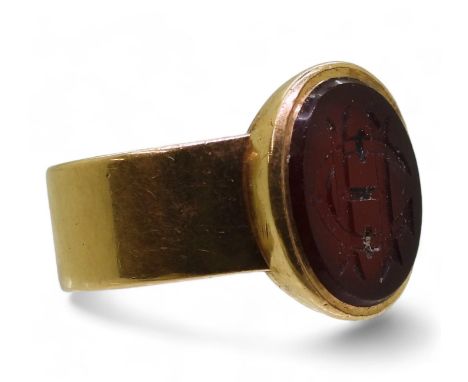 An 18ct gold signet ring, with a monogram intaglio engraved agate , finger size S, weight 11.4gms Condition Report:Available 