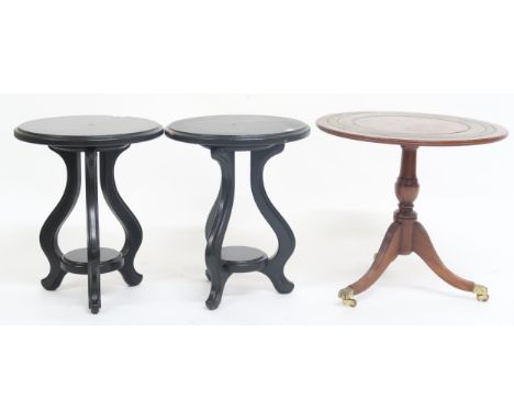 A lot comprising a pair of contemporary ebonised tables with tripod bases and a reproduction circular top wine table (3) Cond