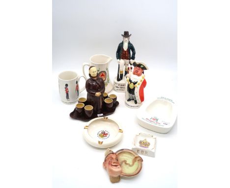 A collection of advertising figures and ashtrays including Canada Dry Ginger Ale, Catto's scotch whisky, Worthington's pale a