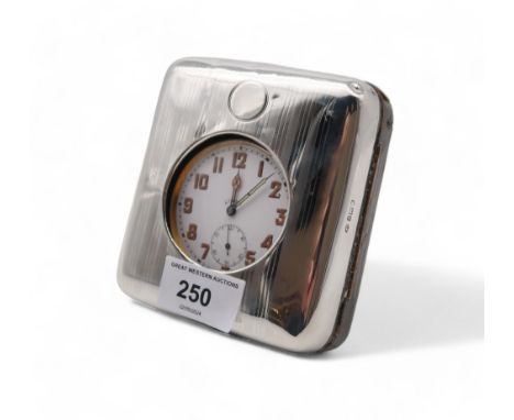 An Edwardian silver cased travelling desk clock, by William Comyns, London 1913, with a goliath pocket watch Condition Report