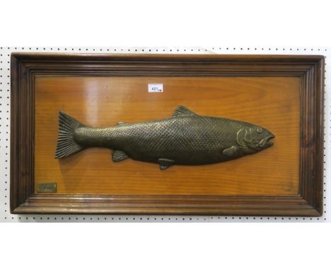 A heavy cast metal salmon wall plaque, measuring approx. 82cm x 42cm; together with a framed print titled&nbsp;Fisherman's Ma