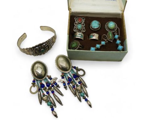 A collection of first nation Navajo &amp; Hopi jewellery, the bangle stamped Sanford, two turquoise and coral rings stamped N