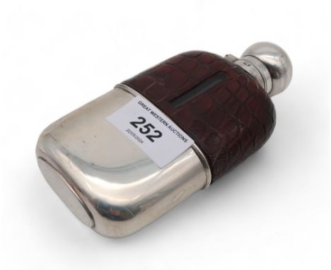 A silver crocodile leather cased glass hip flask, by James Deakin &amp; Sons, Sheffield 1894 Condition Report:Original cork i
