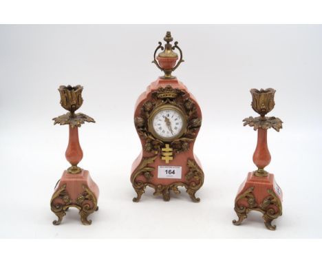 A peach marble clock garniture with Swiss movement, clock 27cm high Condition Report:Available upon request