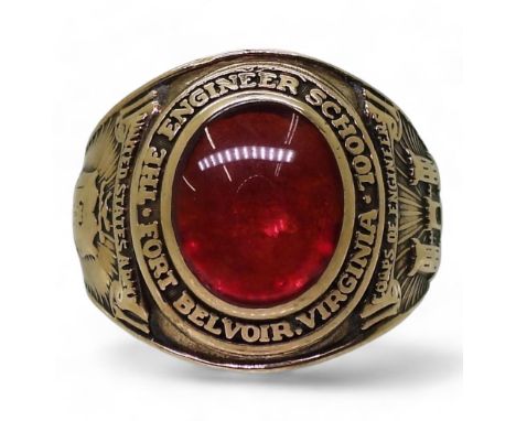A 10k gold Balfour brand American college ring, set with a red glass gem, for The Engineer School, Belvoir Virginia, United S