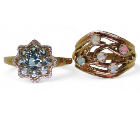 A 9ct gold opal ring, size Q, a blue topaz and diamond flower ring, size S1/2, weight together 6.2gms Condition Report:Availa