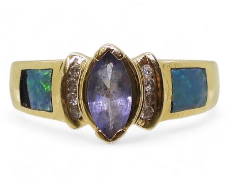 A 14k gold tanzanite, opal and diamond ring, size L1/2, weight 4.5gms Condition Report:Some losses to the opal doublet