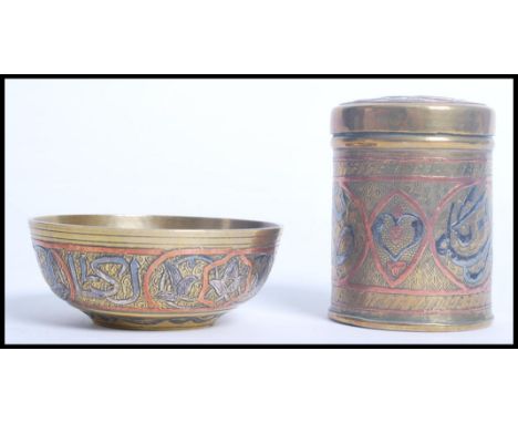 Two pieces of vintage 19th century Egyptian Cairo ware brass. Each piece overlaid with silver and copper calligraphy and symb