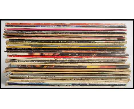 A collection of vinyl long play LP record albums by various artists to include Gong, Yes, Japan, The Style Council, The Beatl