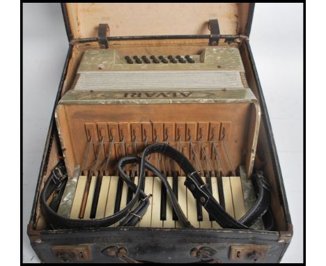 A vintage 20th century Alvari accordion musical instrument complete in original case. Case measures: 24 cm high, 38 cm wide a
