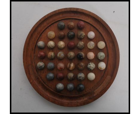 A vintage 20th century solitaire set&nbsp; the marbles / playing pieces made of semi precious / agate stones.