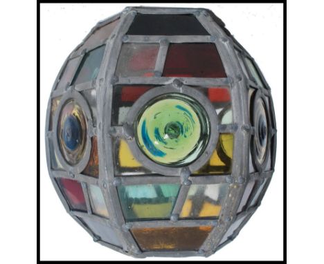 A good early 20th century Arts &amp; Crafts porch lantern. The lantern constructed with mottled and stained glass panels bein