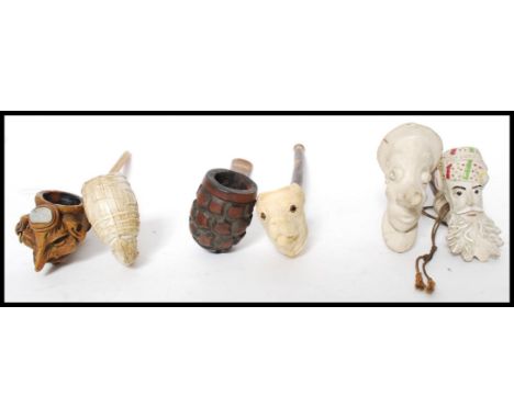 A collection of vintage pipes to include Meerschaum Pipes, novelty, one modelled as a Arabs head by Jacob, Grotesque pipe etc