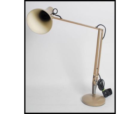 A vintage retro 20th century Herbert Terry Anglepoise desk lamp in a brown colour way, raised on a circular base surmounted w