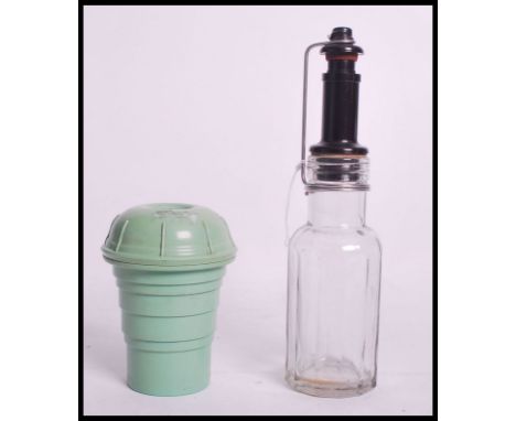 A vintage 20th century early Soda Stream soda siphon bottle of faceted glass form with bakelite top along with a&nbsp;vintage