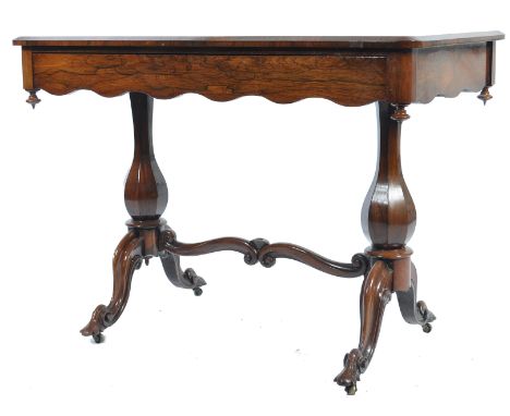 An exquisite 19th century rosewood writing table desk. Raised on hexagonal baluster columns united by turned stretchers with 