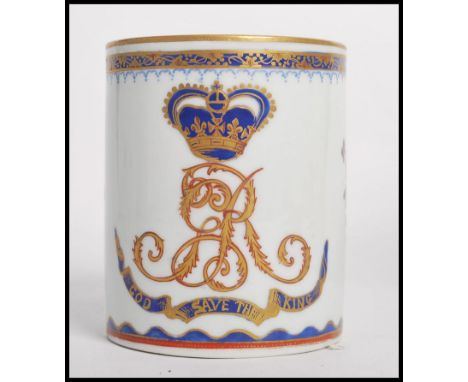 A 19th / 20th century Chinese export ceramic tankard mug having gilt and cobalt decoration depicting a commemorative armorial