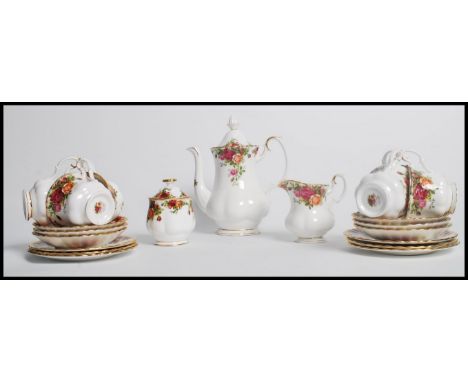 A vintage 20th century Royal Albert Old Country Roses tea service consisting of six cups and saucers, sugar bowl and creamer 