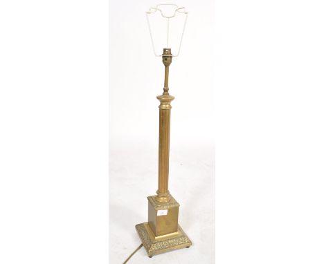 A 19th century large brass column table lamp. The classical column having a square base with acanthus leaf decoration.