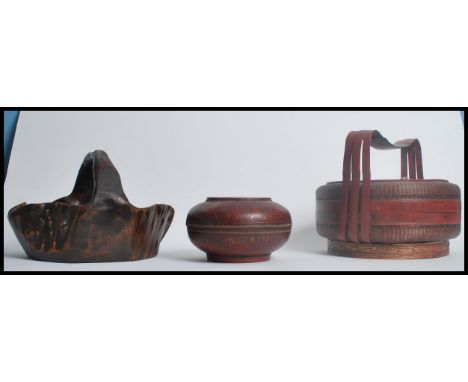 A collection of early 20th century Chinese fur trunk fruit basket together with a rice basket and a small container, all of r