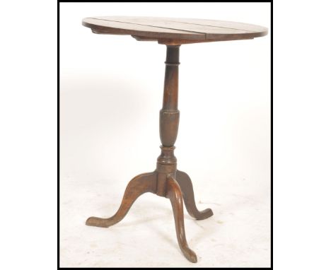 A 19th century Victorian tilt top country oak wine table. Of tripod pedestal form with splayed legs and circular tilting top 