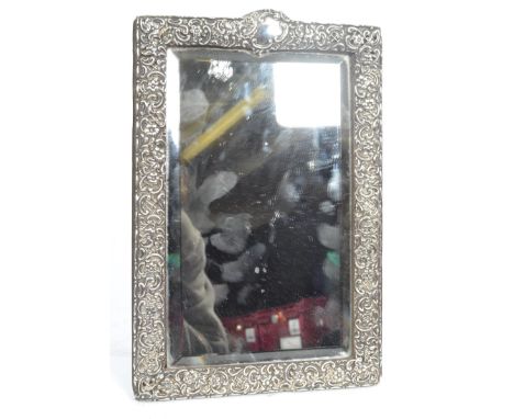 A 19th century Victorian silver hallmarked easel back mirror. The central rectangular bevelled glass mirror housed within an 