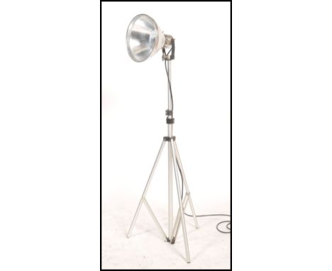 A 20th century retro tripod lamp. Raised on stainless steel adjustable tripod having shaped pendant shade and lamp. Marked fo