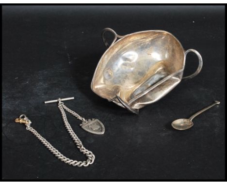 A group of hallmarked silver items to include a silver hallmarked Albert pocket watch chain and armorial fob, a Mappin and We