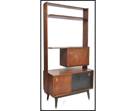 Eric Gomme for G-Plan, a 1950's mid century room divider, with shelf and cupboard arrangement above a cupboard and drawer bas