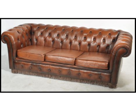 A good brown leather Chesterfield sofa settee - folding bed. Button backed brown leather with barrel arms and 3 cushions to c