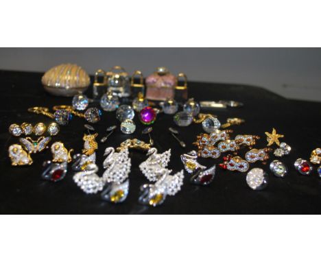 A group of decorative Swarovski crystal crystal trinkets and&nbsp; items to include buttons baubles trinket boxes etc. Please