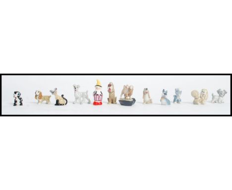 A collection of vintage 20th century Wade ceramic Disney figures to include Lady and the Tramp, Bambi etc along with a camel 