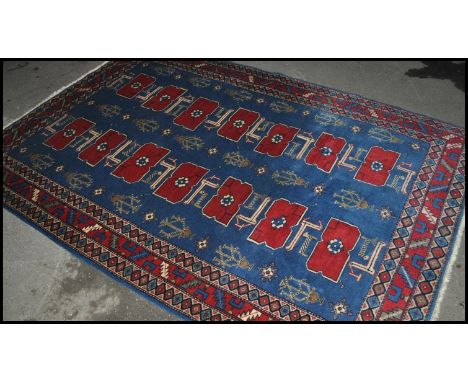 A 20th century handmade Persian carpet rug of wool and foundation cotton construction. The rug having natural dye colouring w