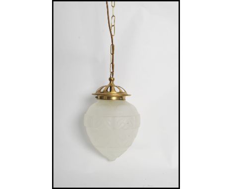 A vintage 20th century French pressed glass and brass porch hanging lantern, the pressed glass shade supported by a brass cei
