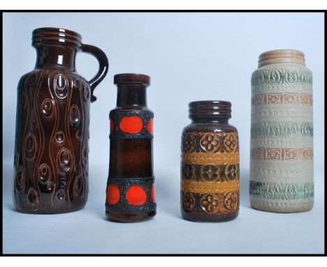 A collection of vintage retro 20th century West German fat lava vases / stick stand, each of differing designs and patterns. 