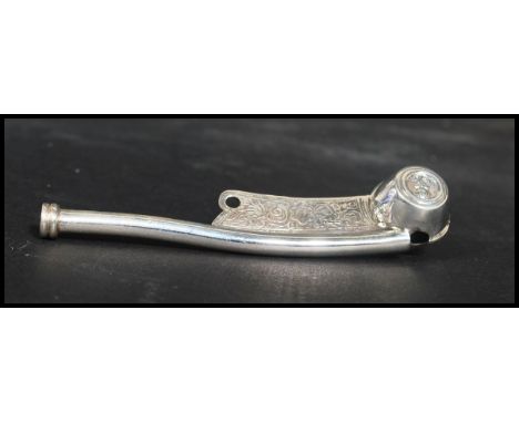 A sterling silver&nbsp; Boatswain Whistle Bosun Call Pipe Nautical Maritime theme with anchor and scrolled design. Measures 1