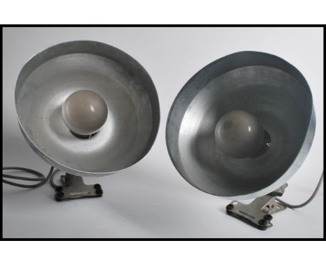 A vintage pair of retro industrial factory pendant desk spot lamp lights having chrome shades with clamp bases. Measures 26cm