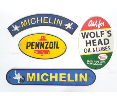 A group of vintage style cast iron advertising point of sale motoring / oil sign plaques to include Michelin, Pennzoil and an