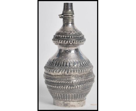 A 19th century Chinese silver drinking flask of bulbous form, the globular body of Gu shape having gadrooned decoration with 