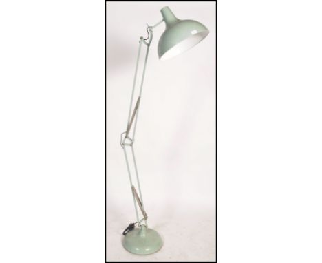 A large Industrial style floor standing anglepoise standard lamp in the manner of Herbert Terry. White with large terraced ba