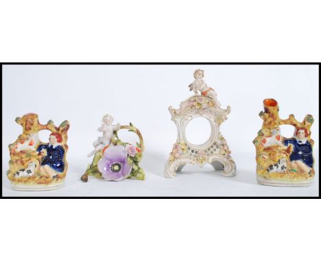 A group of 19th century ceramics to include a pair of Staffordshire flat back spill vases, a Continental&nbsp; clock&nbsp;gar