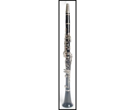 A vintage 20th clarinet by Boosey and Hawkes having silver white metal keys. English made.