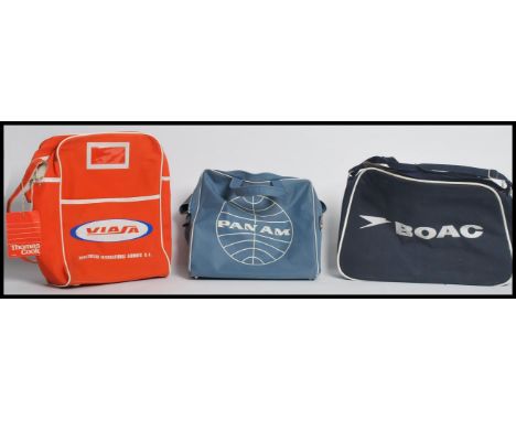 A group of three retro 20th century vintage flight bags to include Panam BOAC and Viasa. Measures 40cms widest.