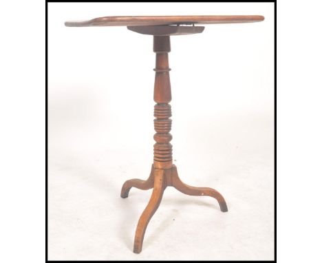 A 19th century Georgian Regency mahogany occasional side wine table raised on a splayed leg tripod base with turned column.&n