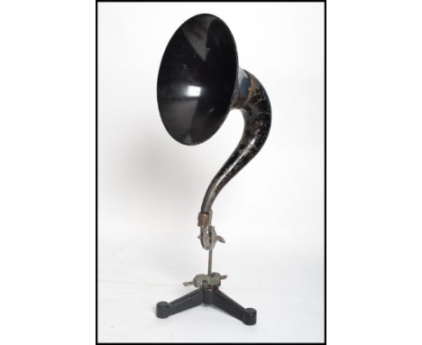 A vintage early 20th century Gramaphone horn raised over industrial metal bracket stand being ideal for conversion to a table