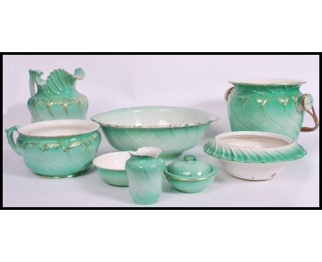 A 19th century Staffordshire ceramic bedroom set comprising washbowl and jug, large chamber bucket and drainer together with 