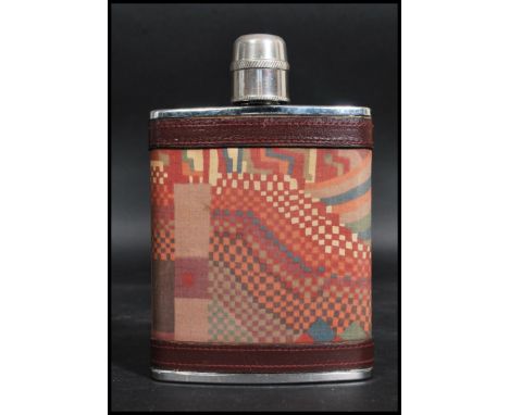 A Liberty of London stainless steel hip flask having an abstract geometric design with leather banding.